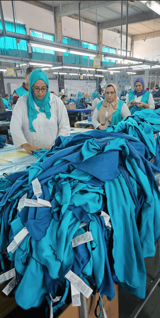 Women in Morocco, sorting a pile of waste